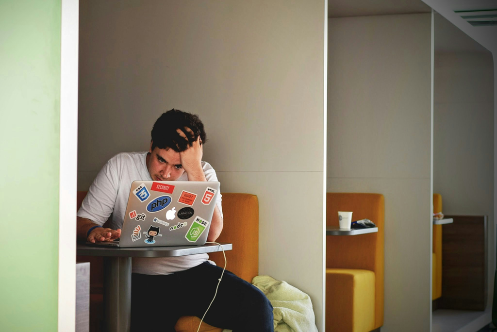 College Student Studying Class Notes to Sell Online as a Side Hustle for Extra Money